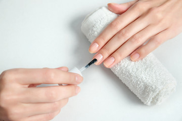 Obraz na płótnie Canvas Woman getting nail manicure.