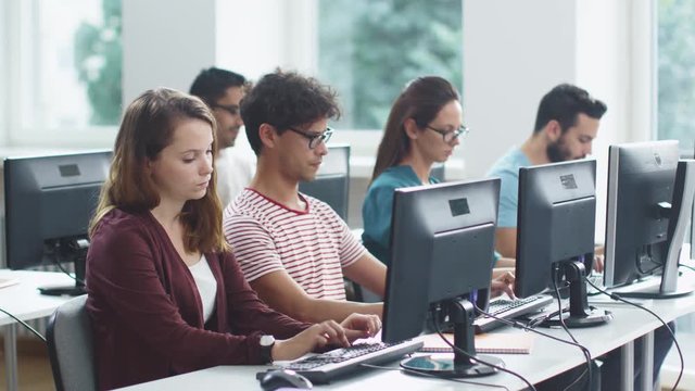 Group of Mixed Race Students working on Computer during Lecture. Shot on RED Cinema Camera in 4K (UHD).