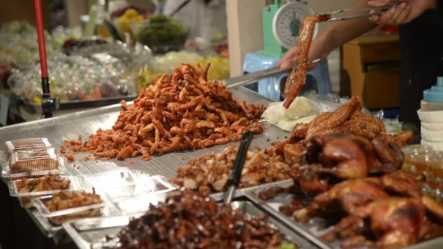 Deep-fried pork in gourmet market street food in Bangkok, Thailand