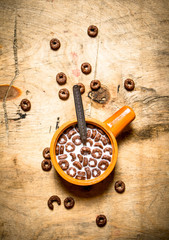 Healthy food. Chocolate cereal with milk.
