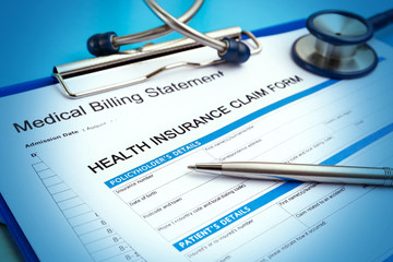 Health insurance claim form with medical bills