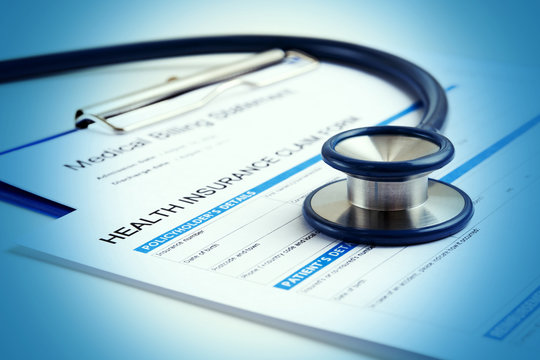 Stethoscope on health insurance form