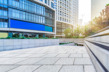 Fototapeta premium empty pavement front of modern office buildings