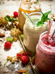 Berry smoothie made from currants, gooseberries and raspberries with nuts.