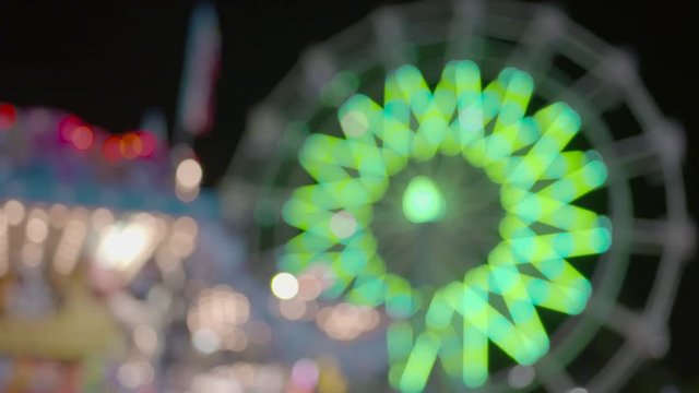 Spinning Ferris Wheel Carnival Out of Focus Colorful Lighting