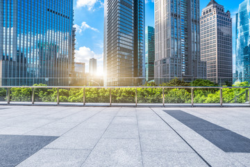 empty brick floor with modern building in background