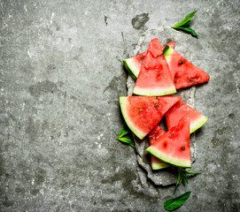 Chunks of watermelon with mint branches.