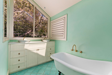 Stylish clean bathroom with shower and bath tub