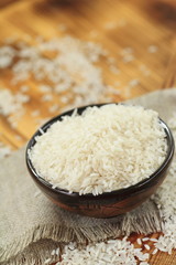 Fototapeta na wymiar Bowl of raw rice grains