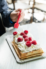 women eating belgian waffles
