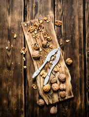 Walnuts with Nutcracker on the Board.