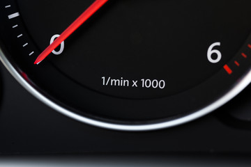 Close up shot of a speedometer in a car