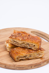 Homemade meat pie over white background