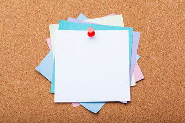 blank note paper on a cork board