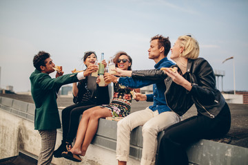 Group of friends celebrating on rooftop