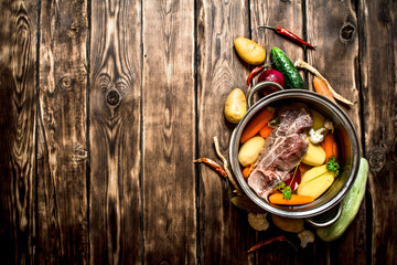 Beef soup with fresh vegetables.