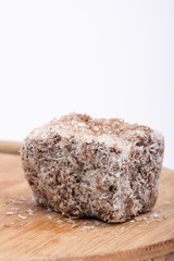 Homemade chocolate cookie with coconut over white background