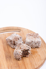 Homemade chocolate cookie with coconut over white background