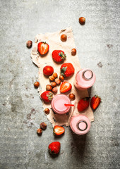 Strawberry juice with nuts on the old fabric.