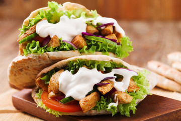 Pita salad with roasted chicken and vegetables, served with a de