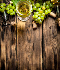 White wine with branches grapes.
