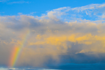 Naklejka na ściany i meble Nature cloudscape with blue sky and white cloud with and rainbow