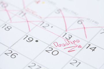 The words Deadline written on a Calendar