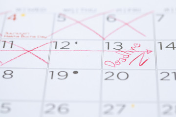 Fototapeta premium The words Deadline written on a Calendar
