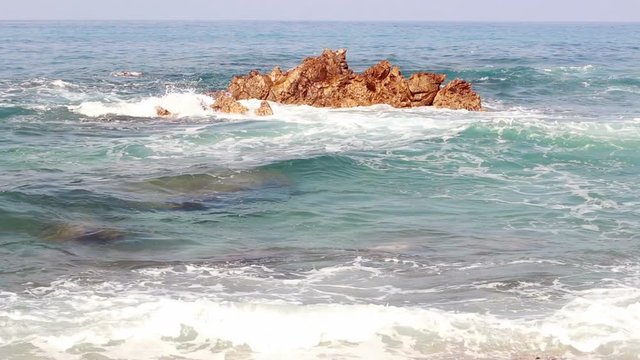 The waves beat on the stone in the Mediterranean Sea