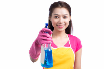 Portrait of a beautiful girl with a detergent for cleaning