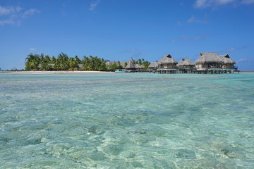Tropical resort on a islet with overwater bungalows, atoll of Tikehau, Tuamotu archipelago, French Polynesia, south Pacific ocean