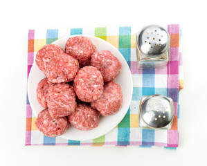 raw homemade meatballs prepared for cooking, isolated