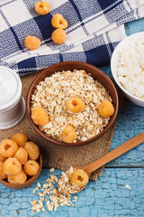 Portion of oatmeal in the bowl with yellow berries