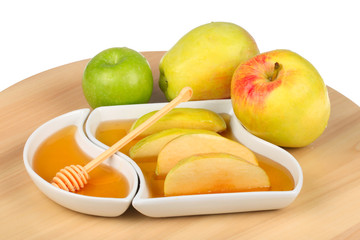 apples and dipping slices of apple in honey