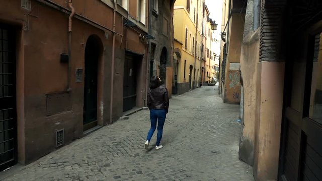 Woman walking through old town in Rome, Italy, super slow motion 240fps
