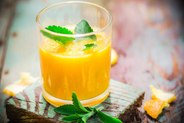 Juice from fresh oranges leaves stevia - obrazy, fototapety, plakaty