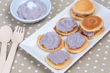 Mini pancake topped stirred taro on gray.Selective focus