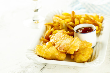 Fish and chips with tomato sauce