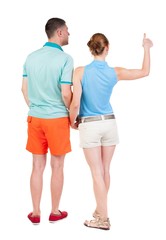 young couple pointing at wal Back view  (woman and man). Rear view people collection.  backside view of person.  Isolated over white background.