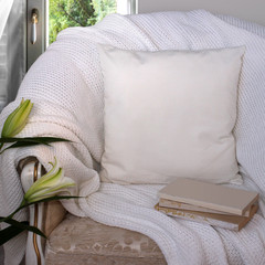 White pillow case Mockup. Pillow on chair in the room.