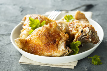 Fried chicken with spices and fresh parsley