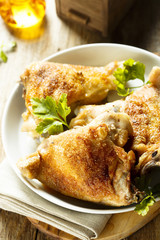 Fried chicken with spices and fresh parsley