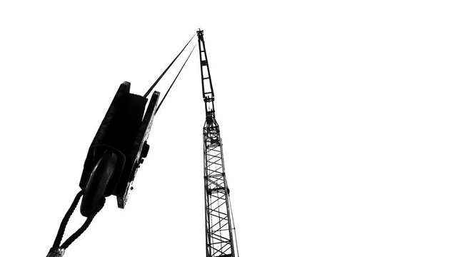 Silhouette of a construction crane on white.