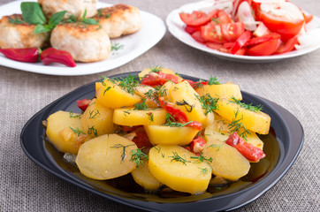 Stewed potatoes with bell pepper closeup