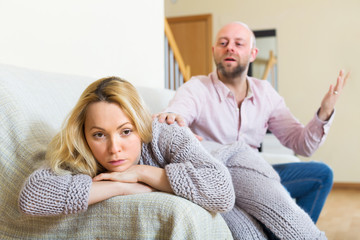 Man consoling the depressed woman