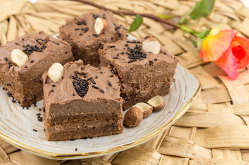 Hazelnut cake covered with chocolate cream