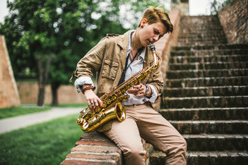 Young woman playing the saxophone