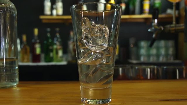 the process of preparing the cocktail in a glass