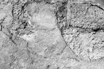 Wall fragment with scratches and cracks
