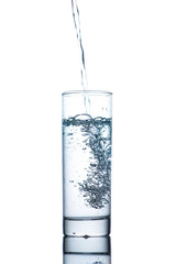 Drinking water is poured into a glass
